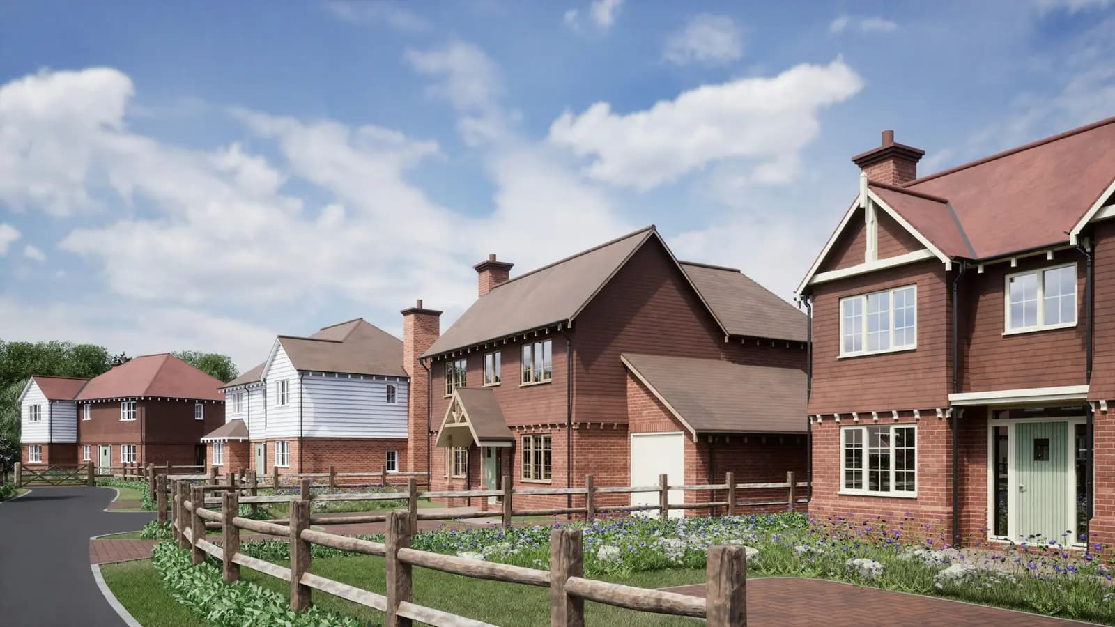 A new-build street of red-brick and white-clad English houses with tiled roofs, chimneys and a post-and-rail fence (computer-generated image)